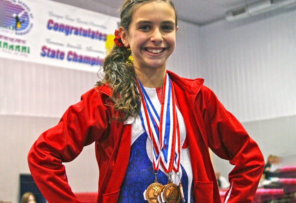 Team gymnast with medals